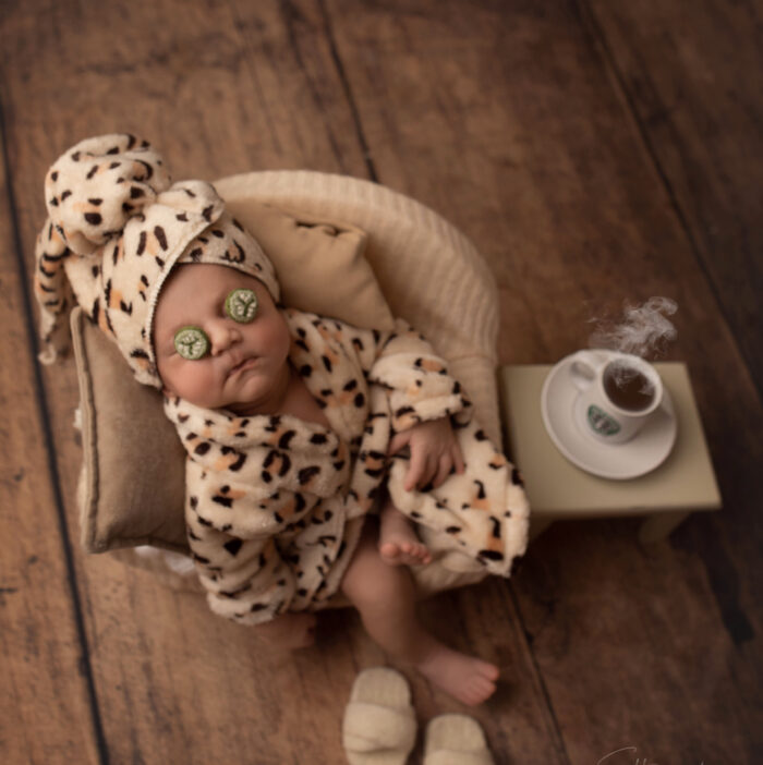 concept newborn baby photo drinking coffee