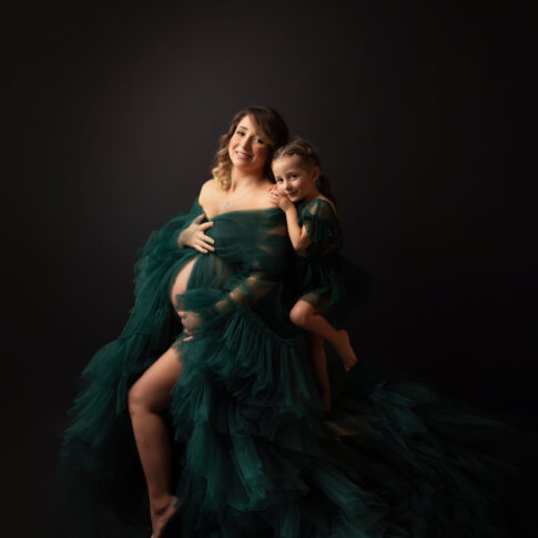 Schwangere Mutter und Tochter Familienfoto