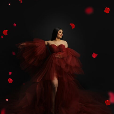 Schwangerschaftsfoto in einem tollen roten Kleid
